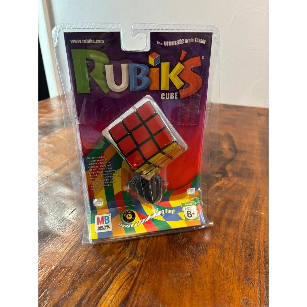 Milton Bradley Rubiks Cube 3x3 Puzzle with Stand and Booklet 54033 New Sealed